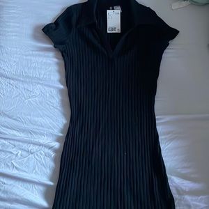 A black mini bodycon dress